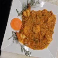166. Camarones Rellenos con Masa de Cangrejo · Shrimp stuffed with crabmeat.