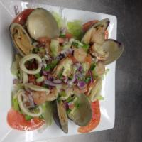 177. Almejas Rellenas con Camarones · Stuffed clams with shrimp.