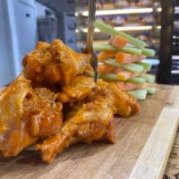 Chicken Wings  ·  1 dozen plain, Buffalo, Sweet Chili, Teriyaki or BBQ