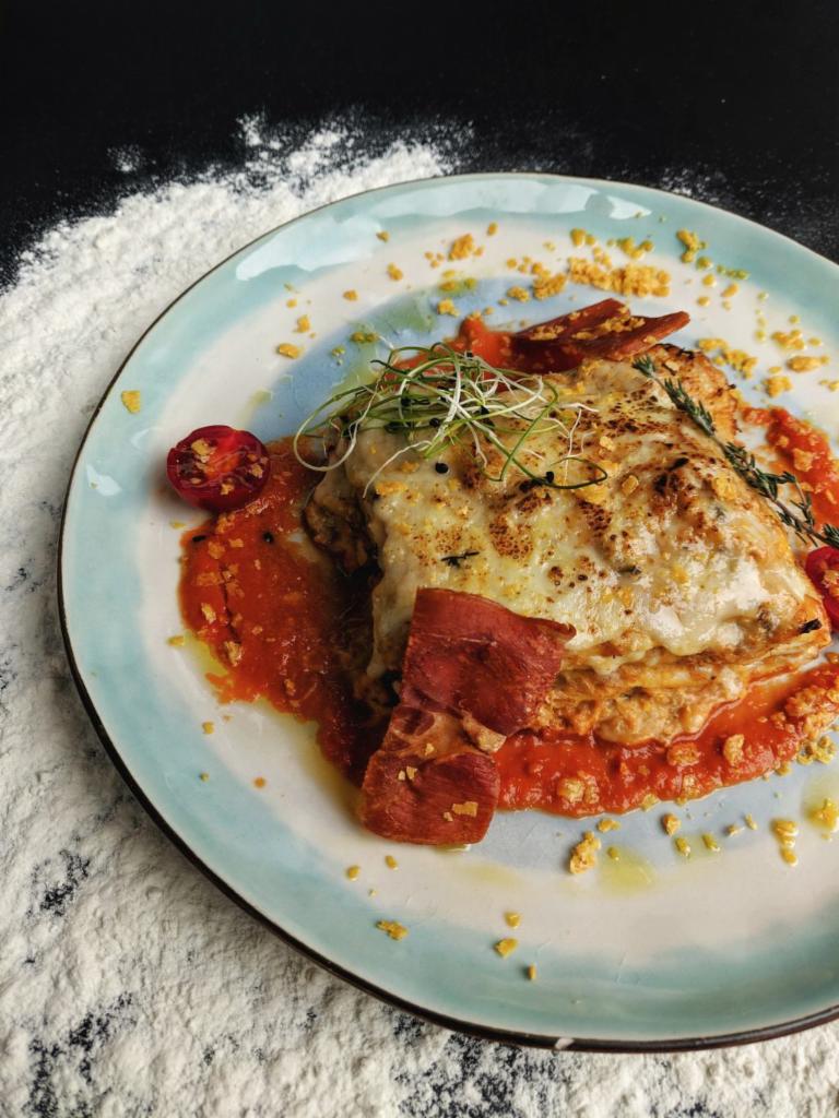 LASAGNA BOLOGNESE  · Pasta lasagna sheet, mozzarella cheese, parmesan cheese, rocotta cheese, ground beef, garlic and marinara sauce