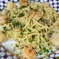 SEAFOOD PASTA  · Spaghetti, shrimps, Scallops and Clams with tomato sauce