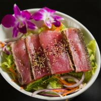 Black Pepper Tuna Salad · Lettuce, onions, carrots topped with avocado, seared black pepper tuna and French dressing.