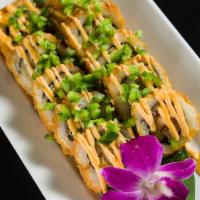 D11. Fire Roll · Deep fried spicy salmon, yellowtail, tuna topped with avocado, jalapeno crunch and special s...