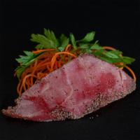 Black Pepper Tuna · Sushi roll prepared with tuna.
