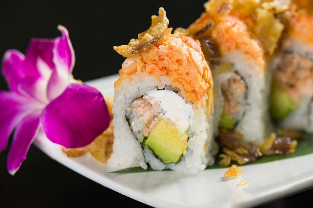 F10. Fuji Roll · Cooked salmon, parve cream cheese and avocado topped with spicy kani and fried onions.