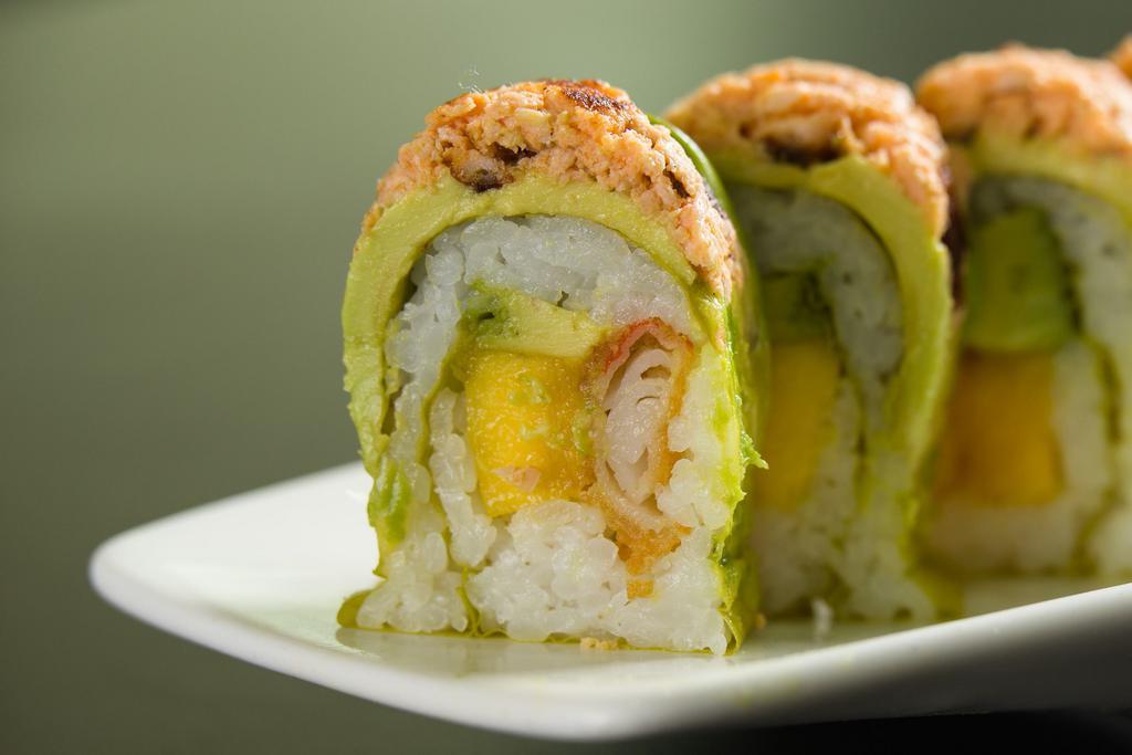 F16. Banzai Roll · Tempura kani, avocado and mango, wrapped with soy paper and topped with cooked spicy salmon.