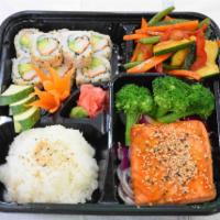 Salmon Teriyaki Bento Box · Salmon steak with teriyaki sauce, California roll, edamame kani salad, sushi rice and a soda...