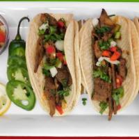 Tacos Mexicanos · Mexican tacos. Bisteac, pollo, carne molida. Beef, chicken, ground beef.