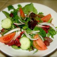 Mista Salad · Mixed green, tomatoes, cucumbers, onions, kalamata olives, homemade Italian dressing on the ...