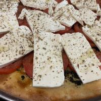 Pesto Pizza · Homemade Pesto sauce, fresh mozzarella and fresh tomatoes. Italian seasoning. Cut in 8 slices 