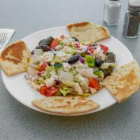 Greek Salad with Pita · Lettuce, tomatoes, onion, Greek olives, feta cheese, cucumbers, anchovies, stuffed grape lea...