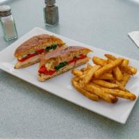 Chicken and Spinach Panini  · Grilled chicken with fresh spinach, roasted red peppers and melted mozzarella.