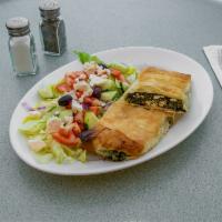 Spanakopita · Flaky phillo stuffed with spinach and feta. Served with side Greek salad.