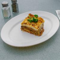 Mousaka · Layers of chopped meat, eggplant and potatoes, covered with special bechamel cream sauce and...