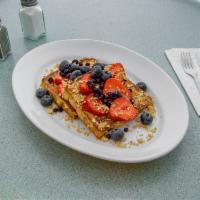 French Toast Napolean  · Fresh strawberries and blueberries sandwiched between 2 slices of french toast, topped with ...