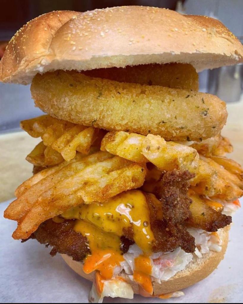 114. The Bullet Sandwich · Chicken fingers, french fries, mozzarella sticks, coleslaw and spicy Russian on toasted bread.