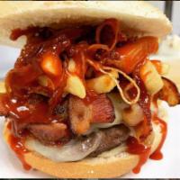 105. Adam's Burger · 1/2 lb. juicy burger, mozzarella, bacon, BBQ sauce, french fries (inside burger), fried onio...
