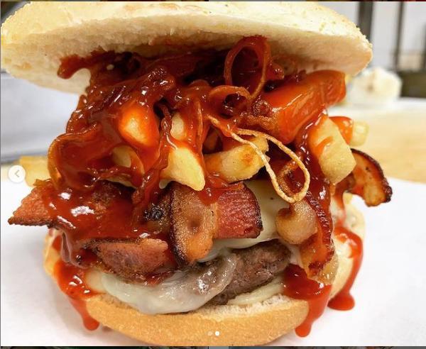 105. Adam's Burger · 1/2 lb. juicy burger, mozzarella, bacon, BBQ sauce, french fries (inside burger), fried onions and special sauce. NOTE: this does not come with a side of french fries.