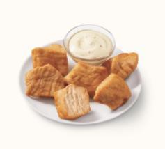 Rotisserie-Style Chicken Bites · DQ's new 100% white meat, juicy, tender, rotisserie-style chicken bites served with house-made Hidden Valley ranch dipping sauce.
