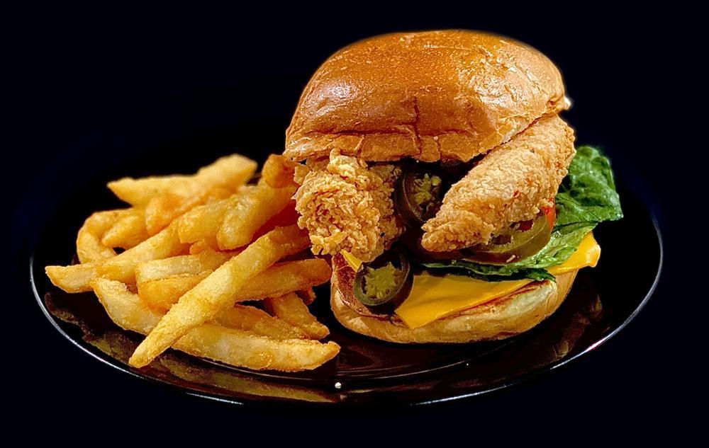 Spicy Chicken Sandwich · Lettuce, tomato, American cheese, jalapeno, spicy grandma sauce and french fries.