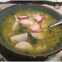 Pozole Verde · Green pozole. A traditional Mexican stew made with hominy, shredded chicken , on the side ra...