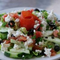 Greek Salad · Romaine lettuce, tomatoes, black olives, pepperoncinis, and feta. 