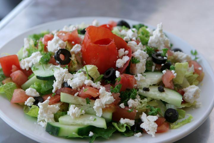 Greek Salad · Romaine lettuce, tomatoes, black olives, pepperoncinis, and feta. 