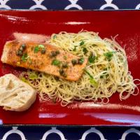 Salmon Picatta · Sauteed salmon with lemon, capers, garlic, vermouth wine sauce, served with pasta.