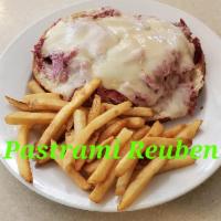 Reuben Sandwich · Choice of hot pastrami or corned beef with sauerkraut melted Swiss and Russian dressing serv...