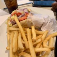 Gyro Sandwich · Authentic sliced gyro or sliced grilled chicken, lettuce, tomato, onion, and tzatziki sauce ...
