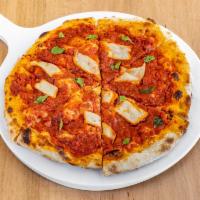 The Margherita Pizza · Tomato sauce, fresh mozzarella cashew based, and basil.