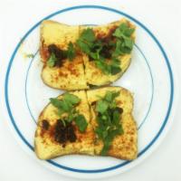 Hummus Toast · House-made Hummus, Parsley, Tomato, Pesto and cilantro served on Gluten-Free multigrain bread.