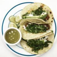 Jackfruit Tacos · Pulled Jackfruit in sun-dried Tomato sauce, served with Onions, Cilantro and Lime served on ...
