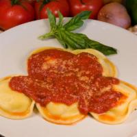 Jumbo Ravioli · Ravioli stuffed with meat or cheese and topped with marinara sauce. Served with fresh, hot g...