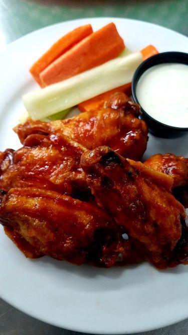 5 Pit Stop Wings · 5 of our tasty chicken wings tossed in a choice of sauce. Served with carrots and celery and your choice of ranch or blue cheese dressing.
