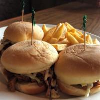 3 House Smoked Pulled Pork Sliders · Using our in-house smoked meat, three tender pulled pork sliders, topped with coleslaw and s...