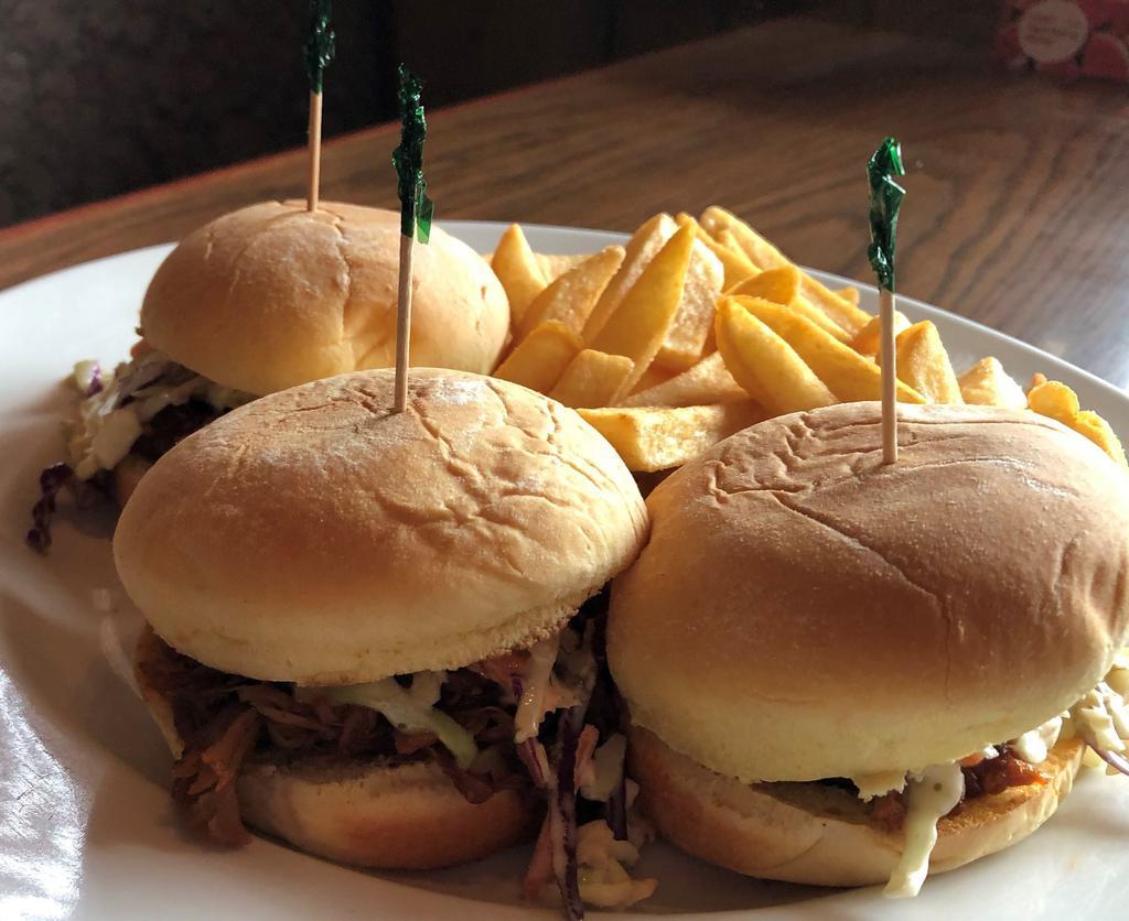 3 House Smoked Pulled Pork Sliders · Using our in-house smoked meat, three tender pulled pork sliders, topped with coleslaw and served with fries.