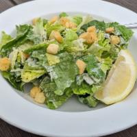 Caesar Salad · Crisp romaine tossed with Caesar dressing and topped with Parmesan cheese and homemade crout...