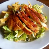 Caesar Salad with Chicken · Crisp romaine tossed with Caesar dressing and topped with Parmesan cheese and homemade crout...