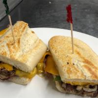 Philly French Dip Sandwich · Sliced beef grilled with onions and green peppers topped with melted cheddar cheese on a sou...
