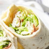 CHICKEN CAESAR WRAP · Grilled chicken, romaine lettuce, parmesan cheese & Caesar dressing in a tortilla wrap with ...