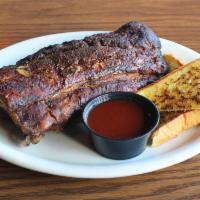 Baby Back Pork Ribs · Tender smoked ribs served with our house made BBQ sauce and a choice of 1 signature side and...