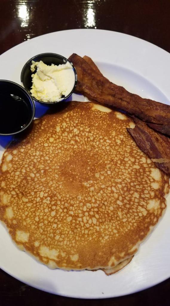 2 Pancake Stack - Served all day! · Fluffy pancakes served with butter and warm maple syrup.
