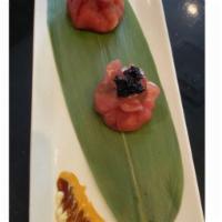 Tuna Dumpling · Black tobiko, avocado, tossed with crunch.