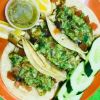 75. Chicken Tacos · 3 tacos served with guacamole, pico de gallo, and salsa.