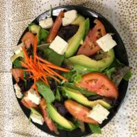 78. Avocado and Tomato Salad · Mixed greens, avocado, tomato, Feta Cheese, Shredded Carrots and Dijon vinaigrette Dressing.