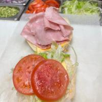 42. Ham Sandwich · Topped with lettuce, tomatoes, and mayonnaise.