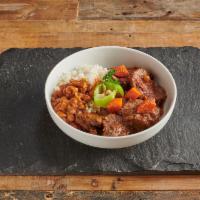 Carne Guisada · Beef stew. Served with your choice of one of the following, rice and beans, green or yellow ...