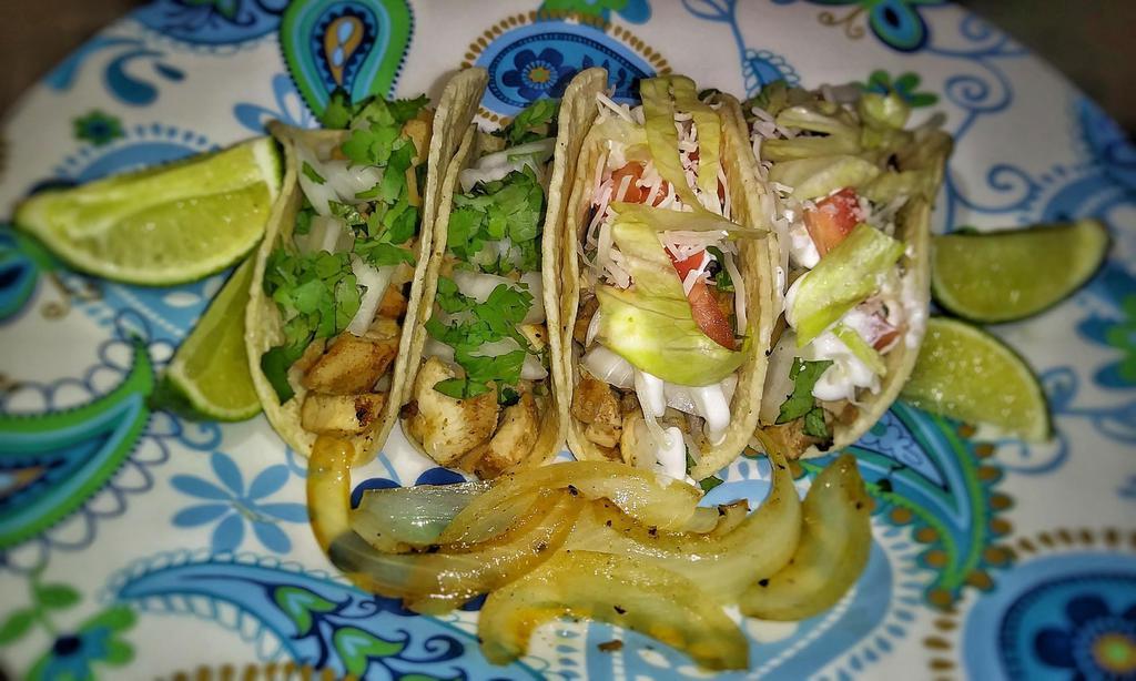 Fish or Shrimp Tacos · 3 tacos with pop.