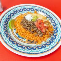 Carnitas (Pork) Rice Bowl · Rice, cheese, pico de gallo, guacamole & sour cream. Served with a side of tortilla chips.